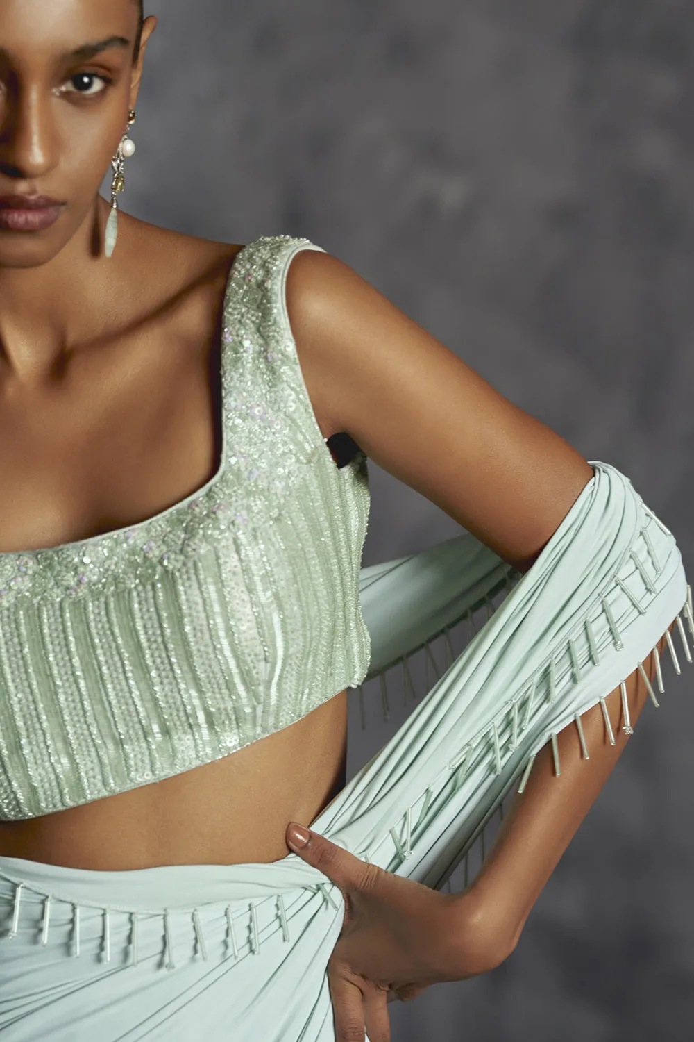 Fitted Draped Saree With Sleeveless Blouse